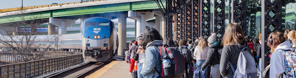 Passengers wait to board a train at Richmond, Va.