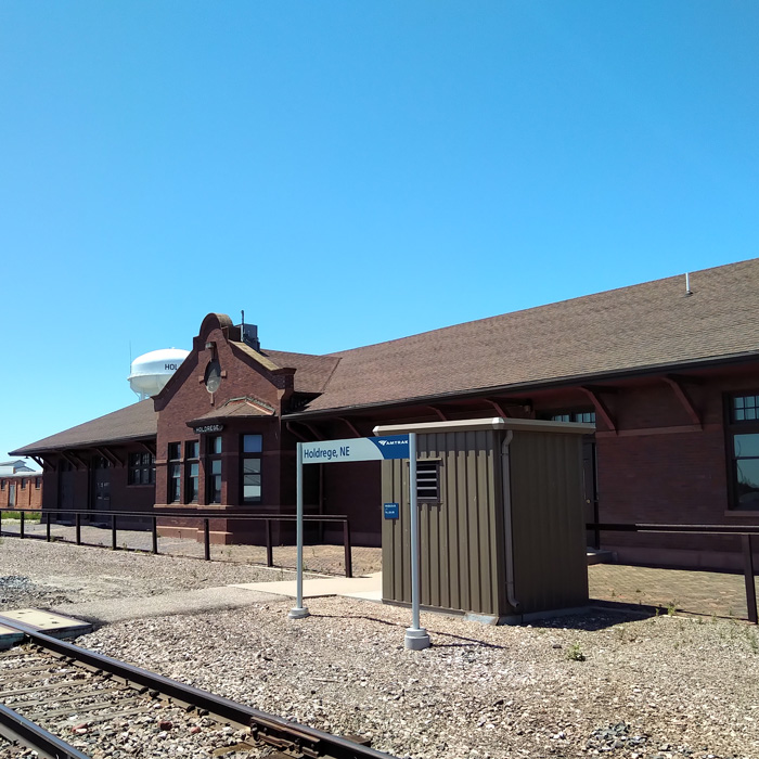 One story red brick train depot.