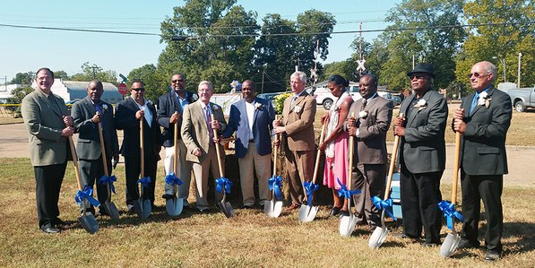 Officials with shovels at groundbreaking ceremony