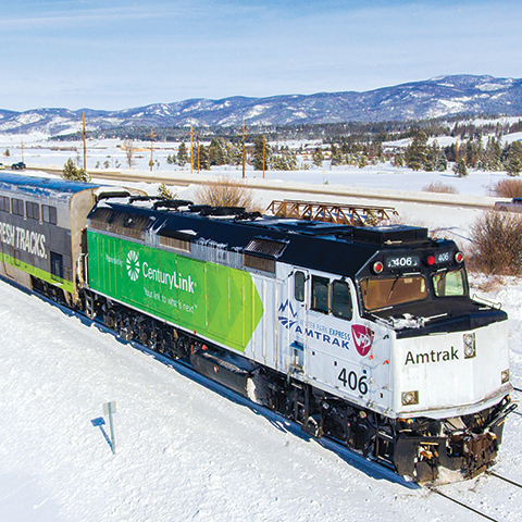Amtrak Winter Park Express in a snowy landscape.