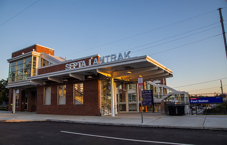 Northern entrance to the Paoli station, which leads to a pedestrian overpass above the tracks.