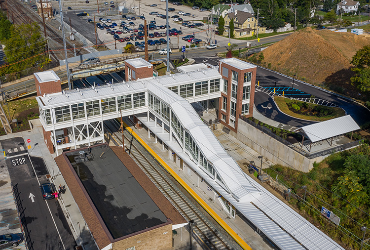 Aerial view of the Paoli station showing the center platform, depot and pedestrian overpass above the tracks.