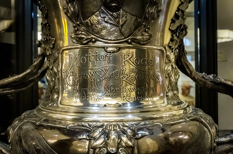 Close-up of the silver Moffat Cup with an inscription reading, "Moffat Road, The Gateway through the Rockies."