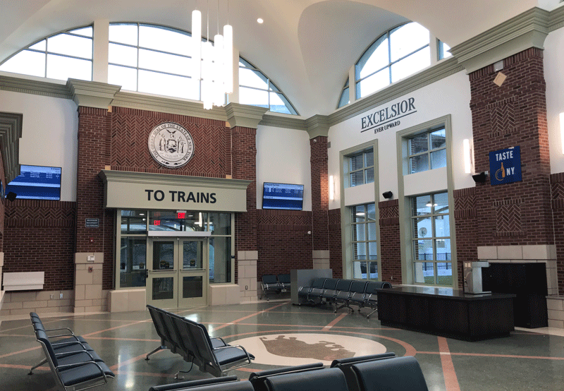 Interior of Buffalo Exchange Street Station showing a waiting room with benches.