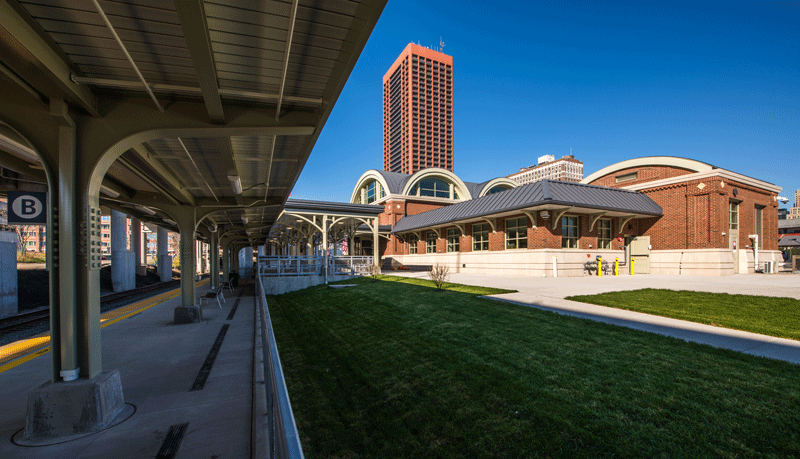 View of Buffalo Exchange Street Station across a lawn.