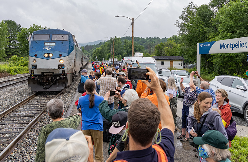 The Amtrak Vermonter pulls into Montpelier station as a crowd takes photos.