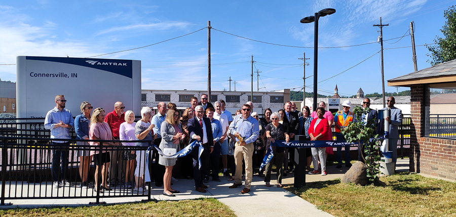 A group cuts a ribbon on station improvements in Connersville, Indiana.