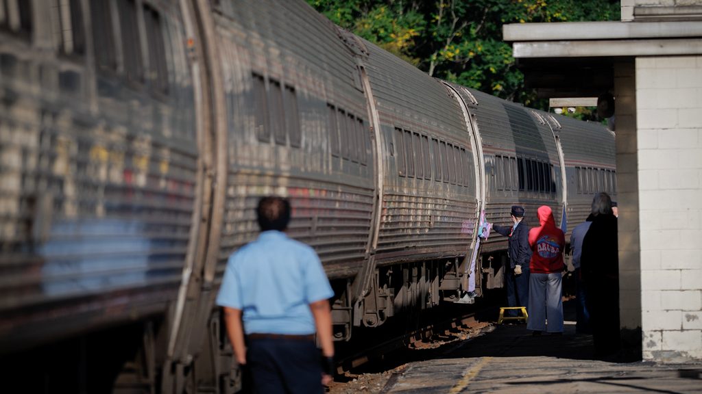 Customers board a train.